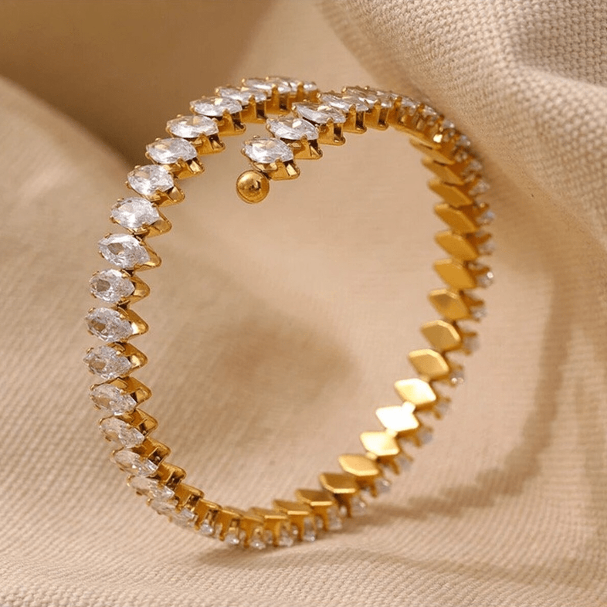 Non-tarnish marquise zircon gold bangle bracelet worn on a woman's wrist – MH Elegance