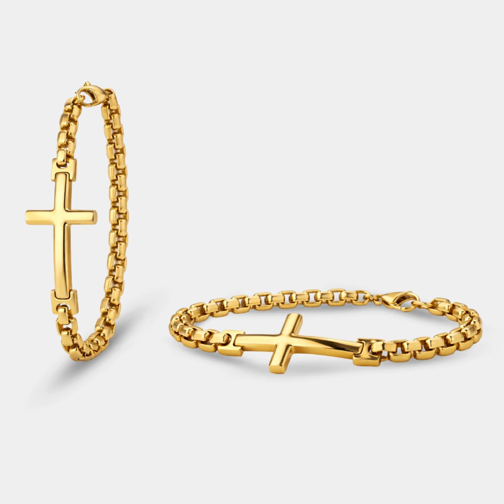 Close-up of the gold cross centerpiece on the men's stainless steel cross bracelet