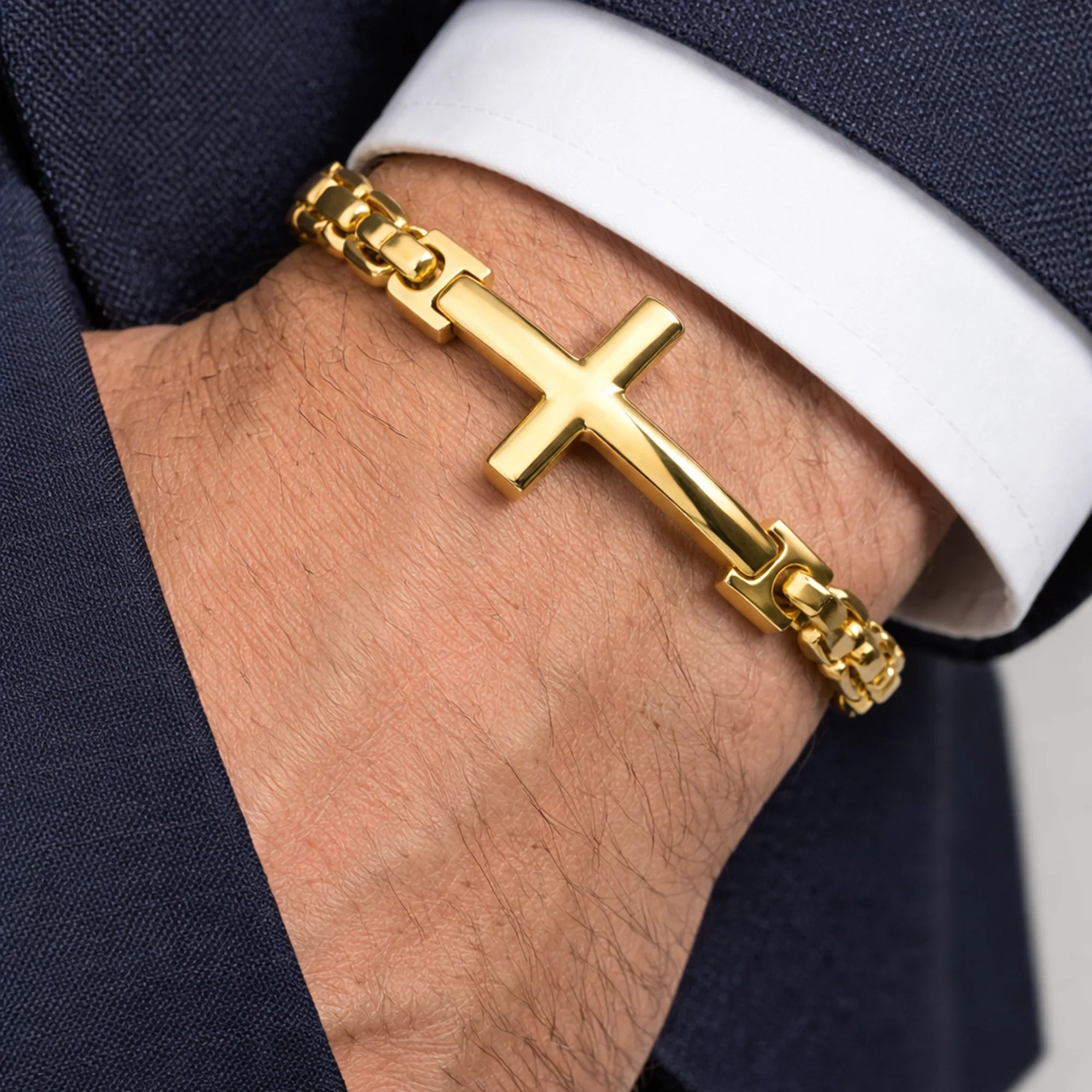 Detail of the lobster clasp and cable chain on the gold men's cross bracelet