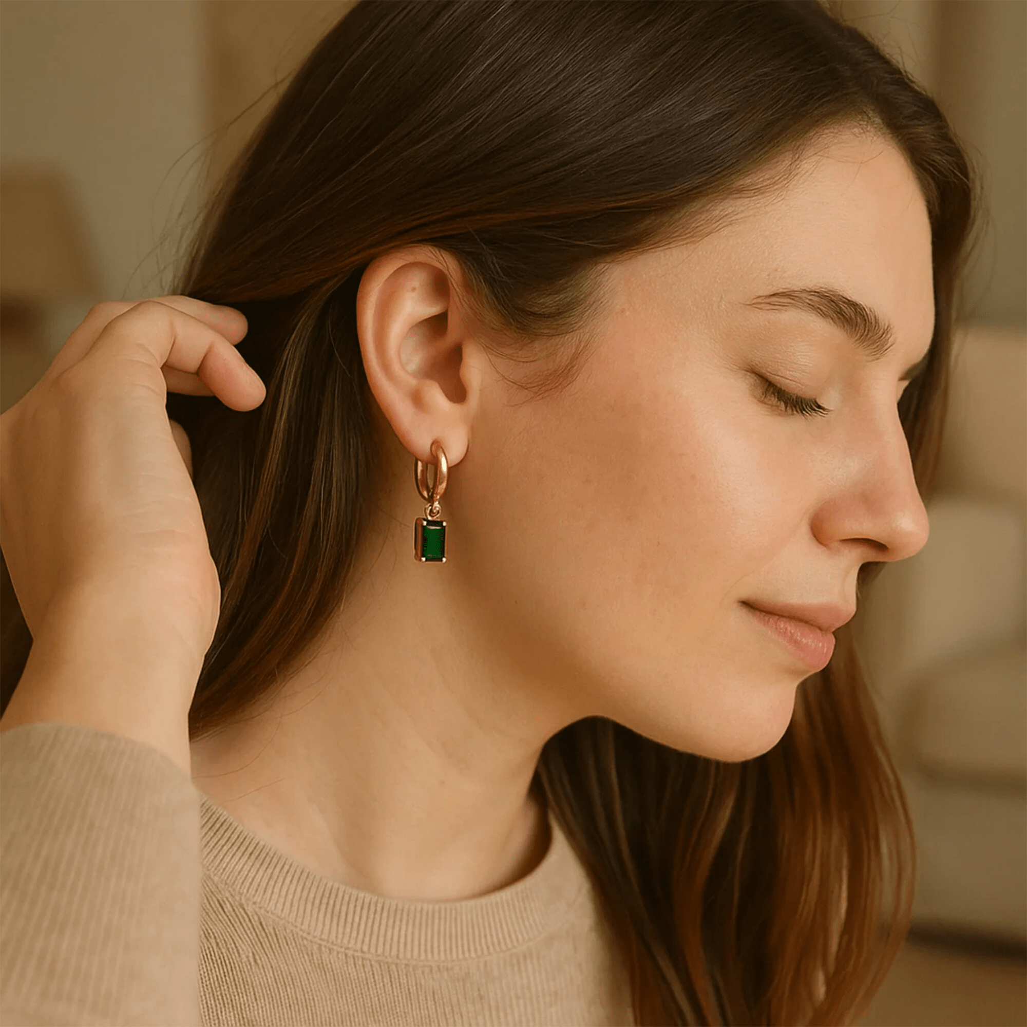 Emerald green hoop earrings displayed in an MH Elegance gift box