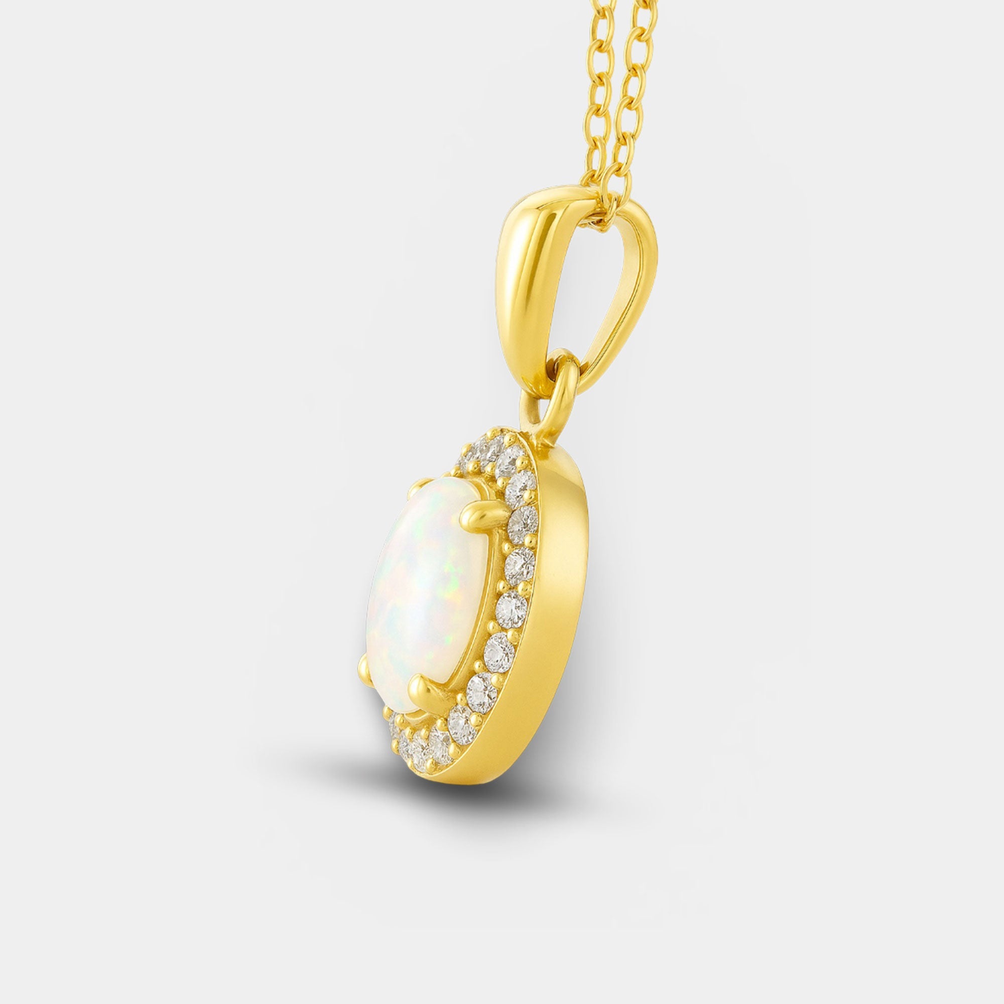 White opal halo pendant necklace shown with its 18 inch cable chain and spring ring clasp.