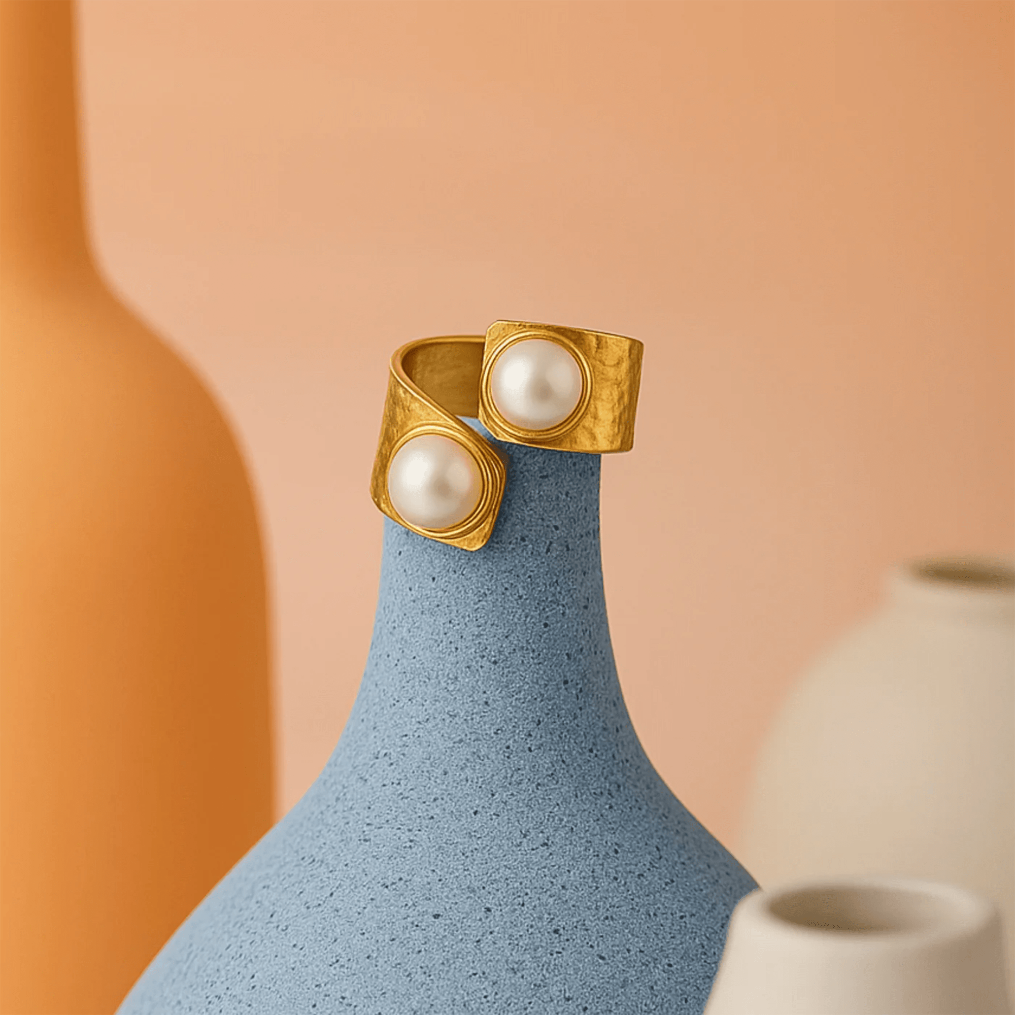 Opulent duo pearl cocktail ring worn on a hand showing the bold double pearl statement style