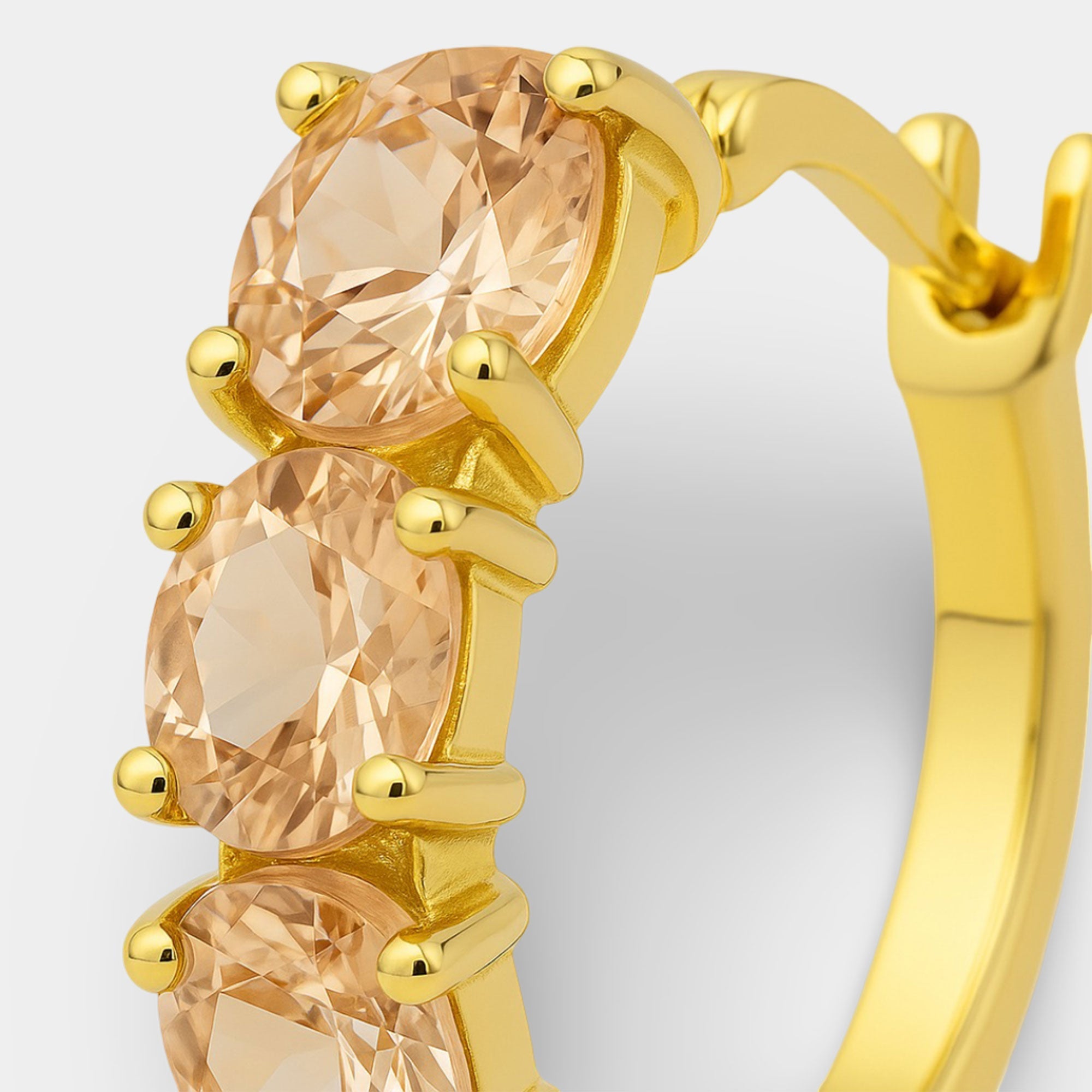 Oval morganite hoop earrings showing the hinged latch-back closure.