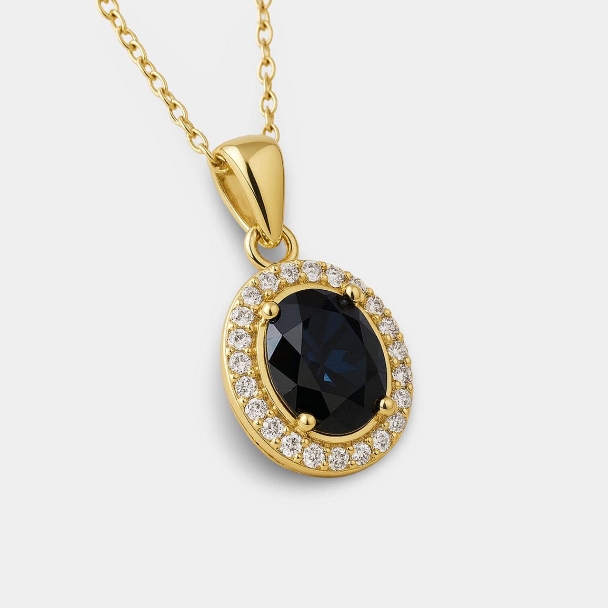 Black onyx halo necklace shown with its gold-plated 18 inch cable chain and spring ring clasp.