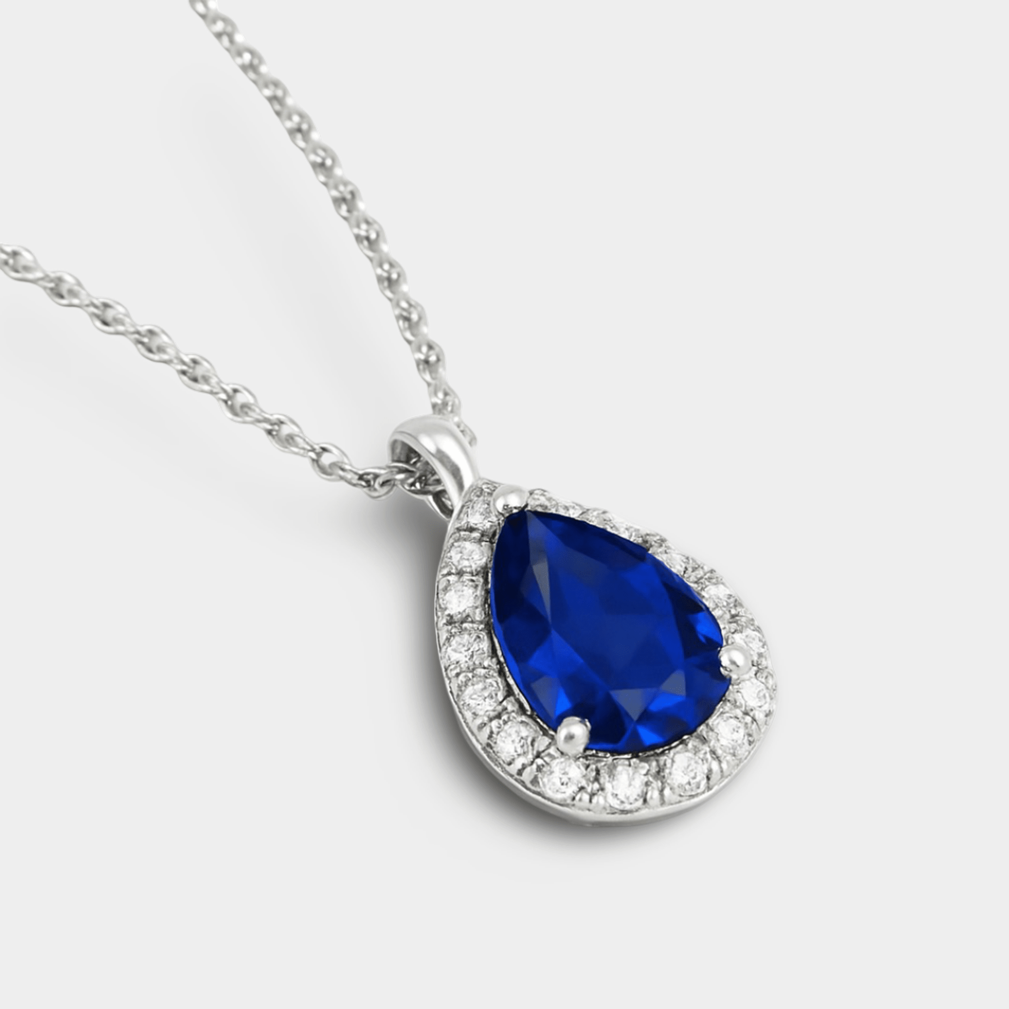 Side view of the pear sapphire pendant showing the prong setting