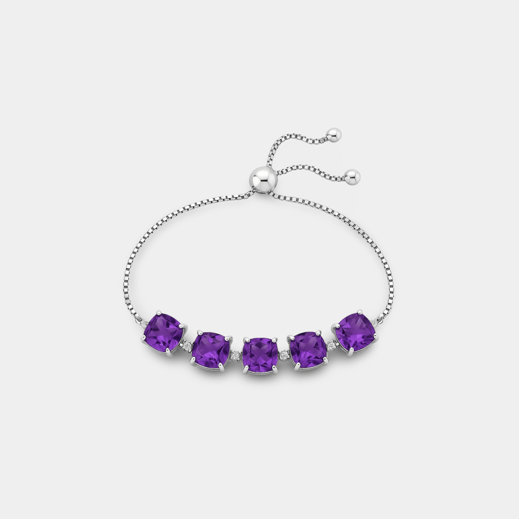 Sena Amethyst Cushion Tennis Bracelet curved into a bolo arc, displaying the adjustable sterling silver slide chain with ball-tip ends and five cushion-cut amethyst stones