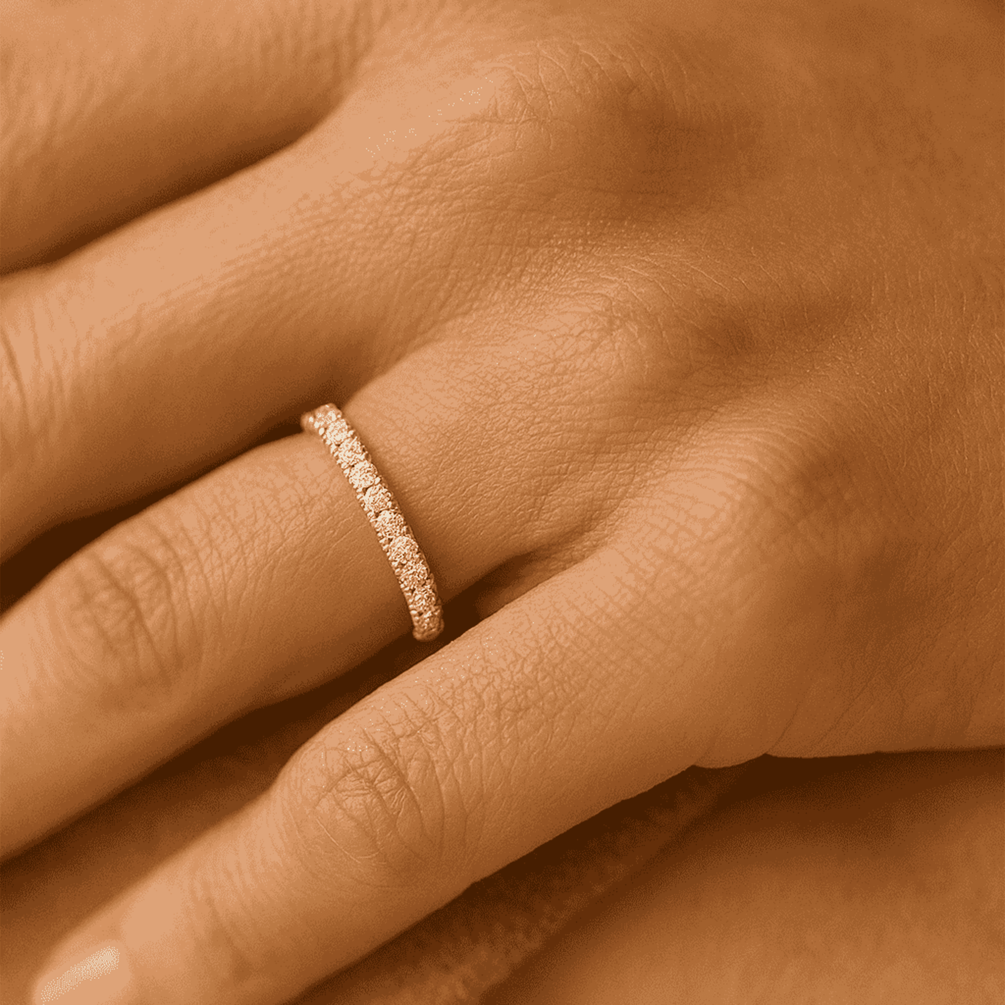 Angled view of the MH Elegance half eternity cubic zirconia ring sparkling in light