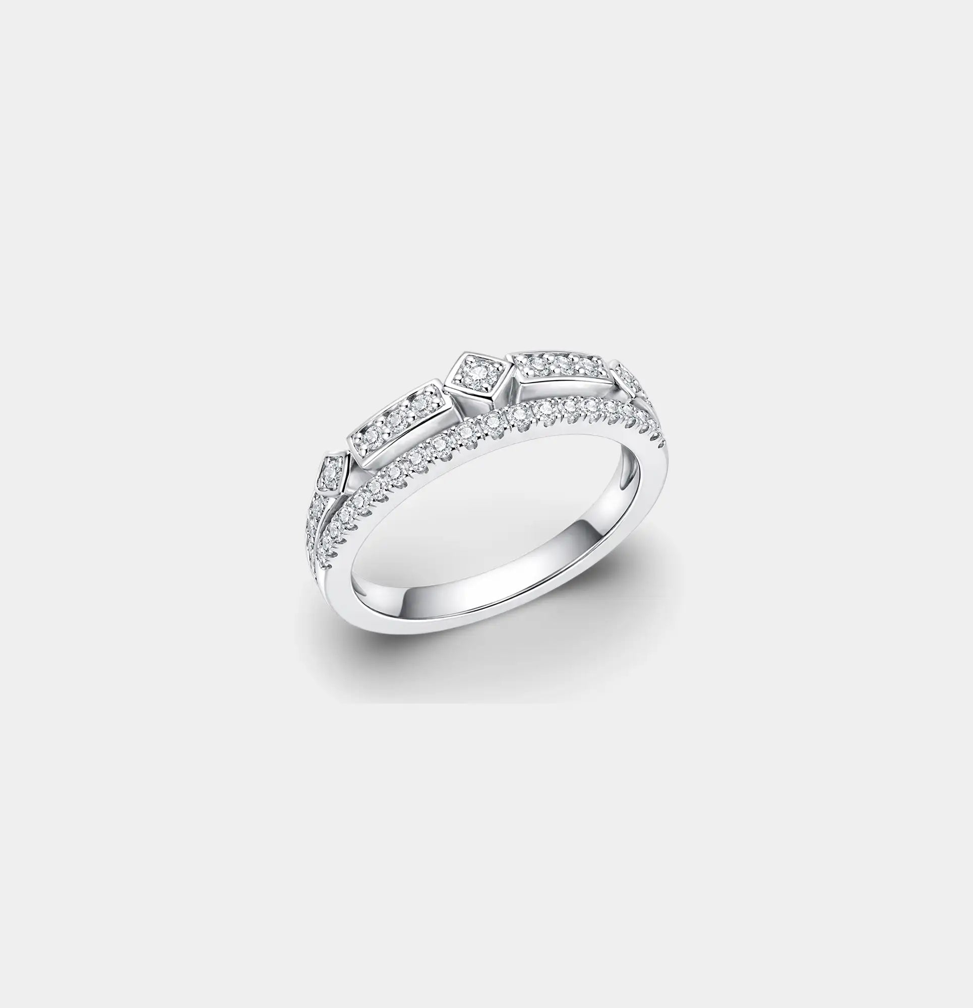 Side angle of a moissanite stacking ring in sterling silver with a pave row and geometric stations