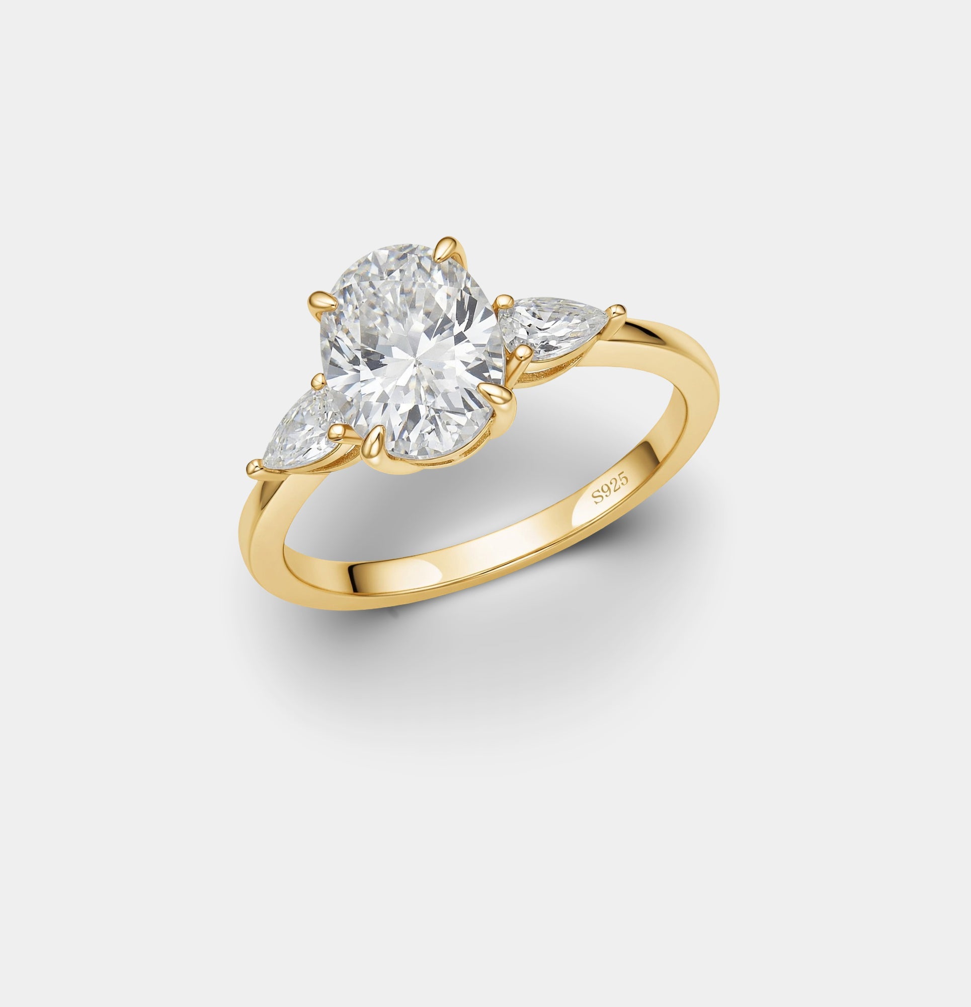 Oval and pear cubic zirconia trilogy ring in silver, top view