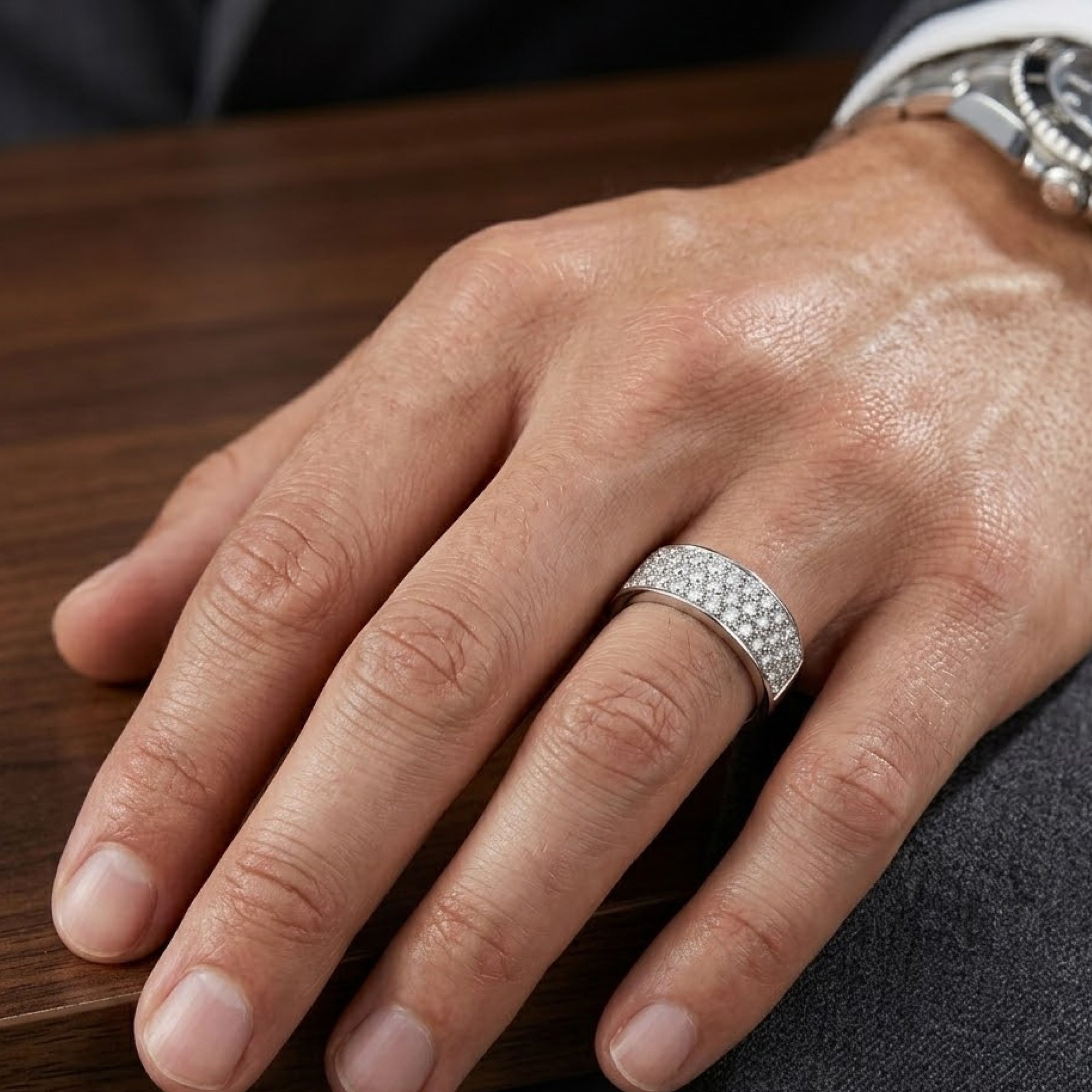 Silver diamond-look men's wedding ring, top view of the full band