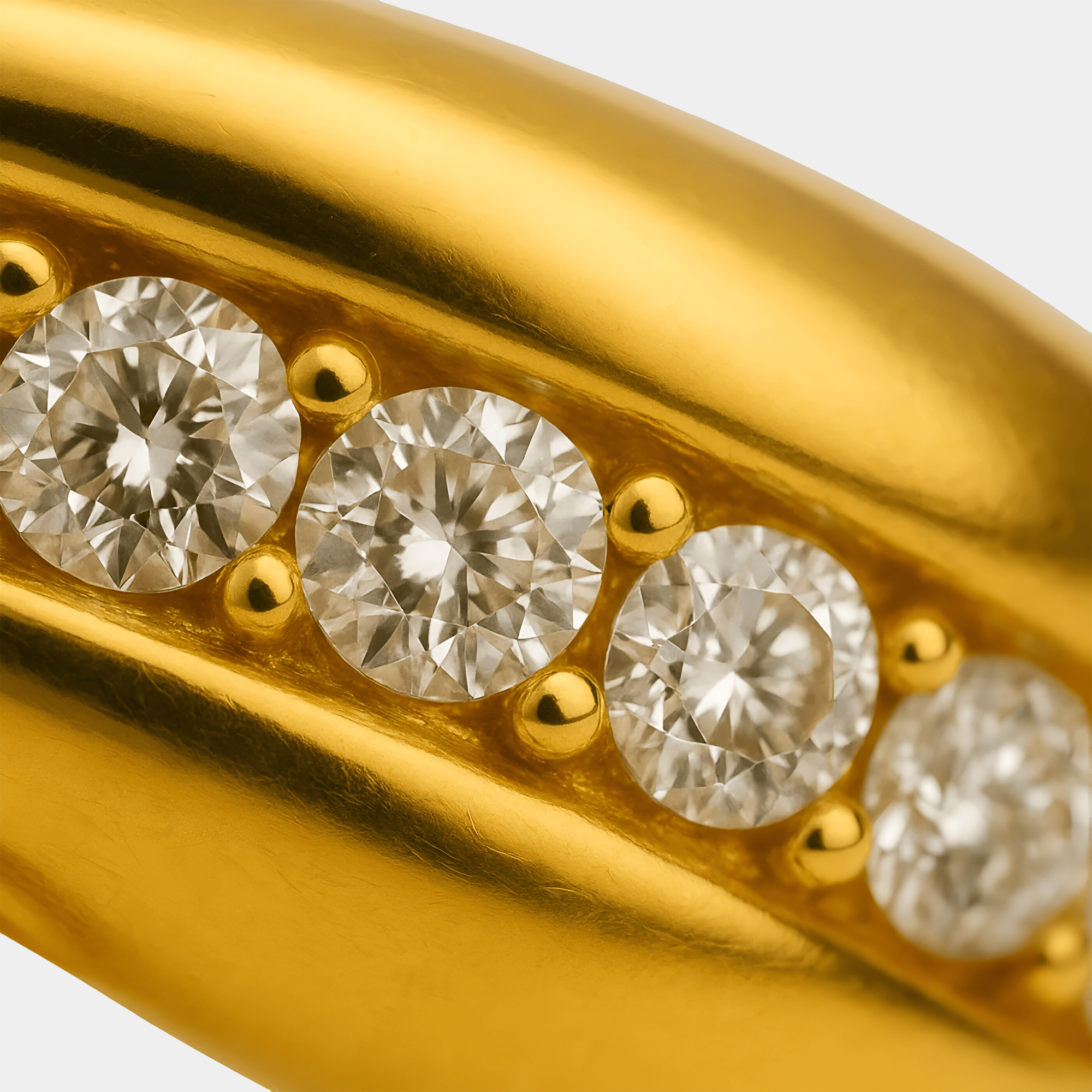 Close-up of the cubic zirconia swirl design on the 18K gold plated stainless steel ring