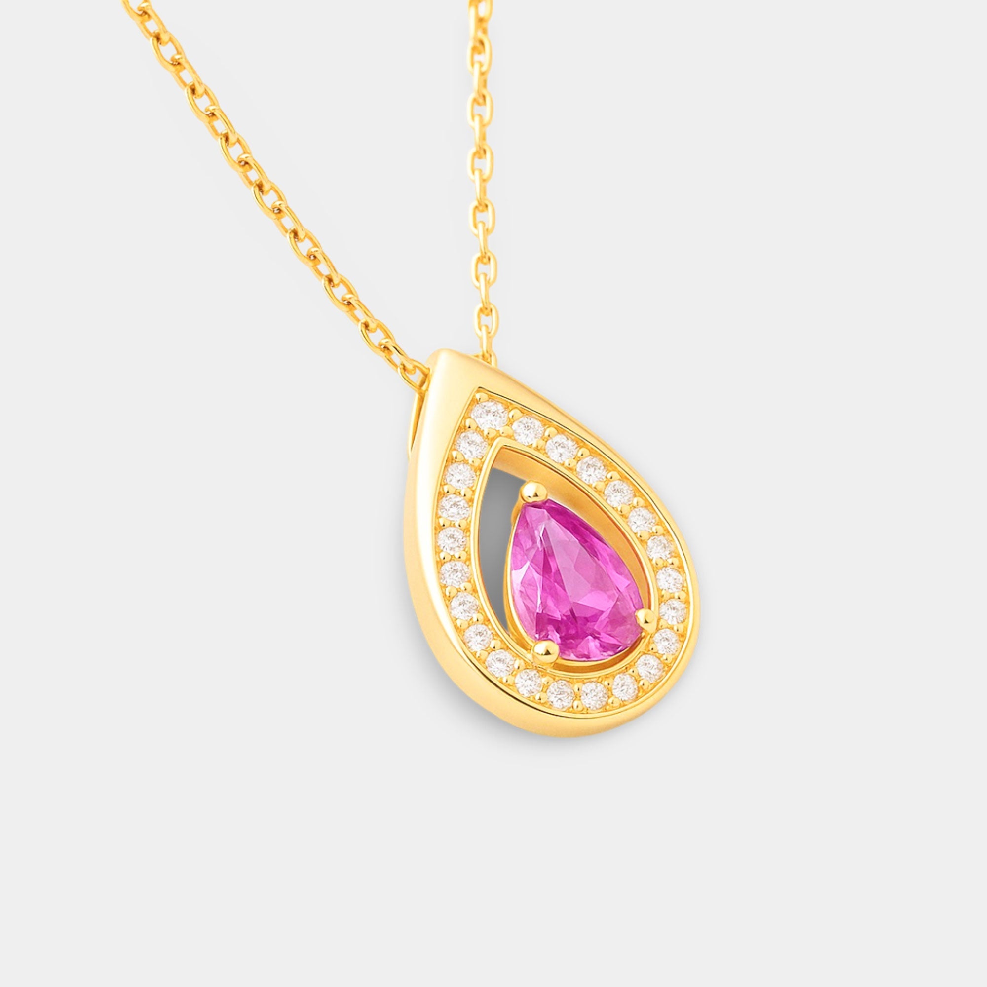 Close-up of the pear-shaped pink tourmaline in a gold-plated prong setting.