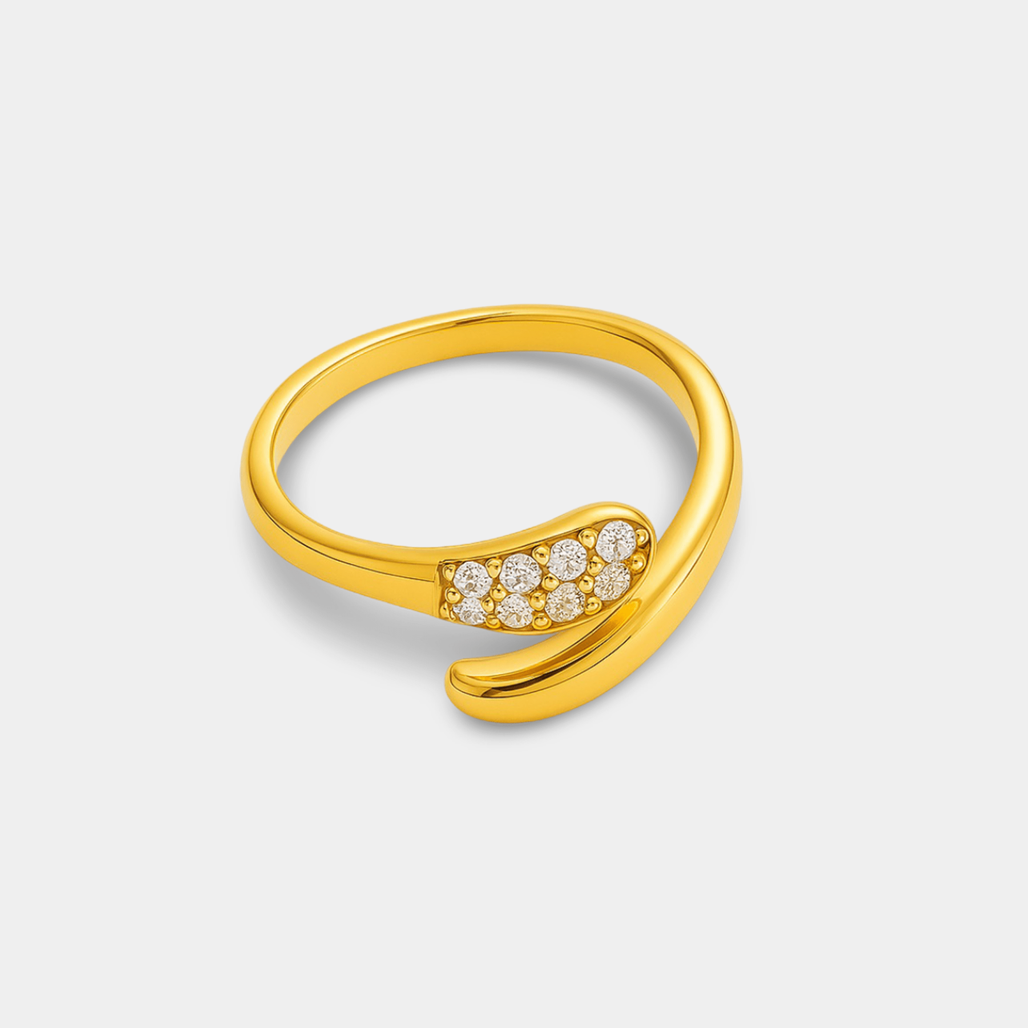 Close-up of the round CZ stones hand-set in the twisted gold band of the solitaire ring