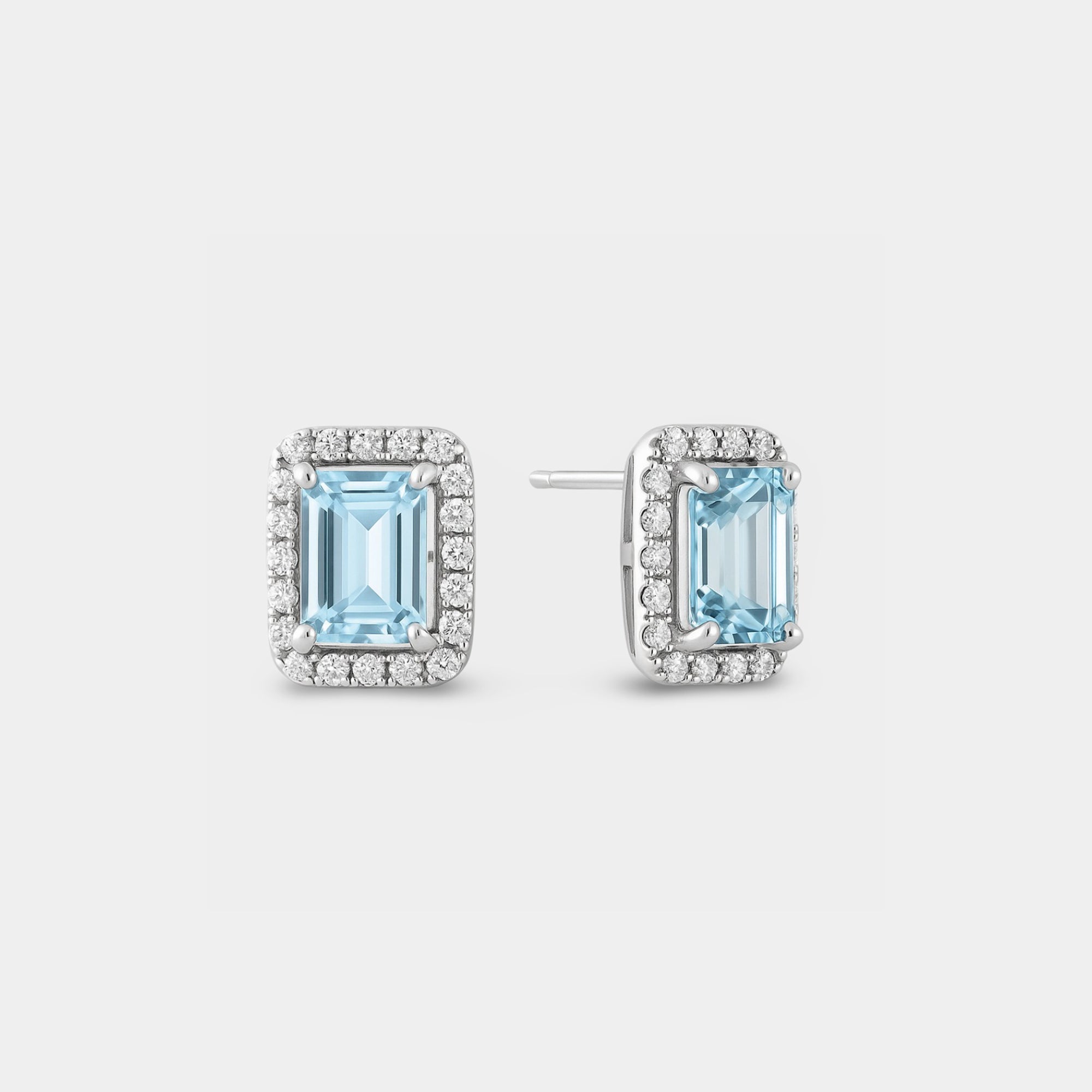 Angled view of the aquamarine halo studs showing the silver posts and push-back closures