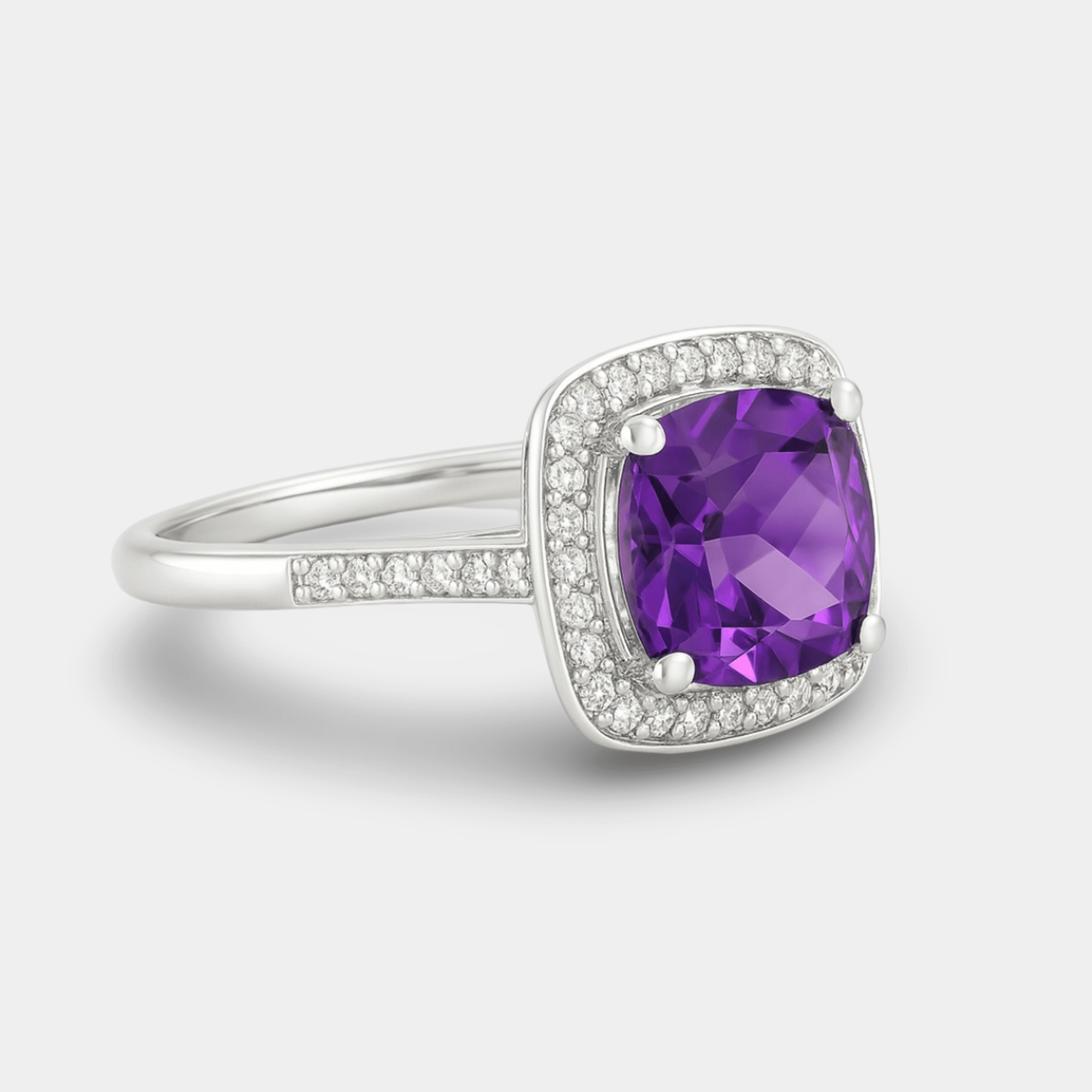 Angled front view of the cushion amethyst with its moissanite halo and pavé sterling silver band