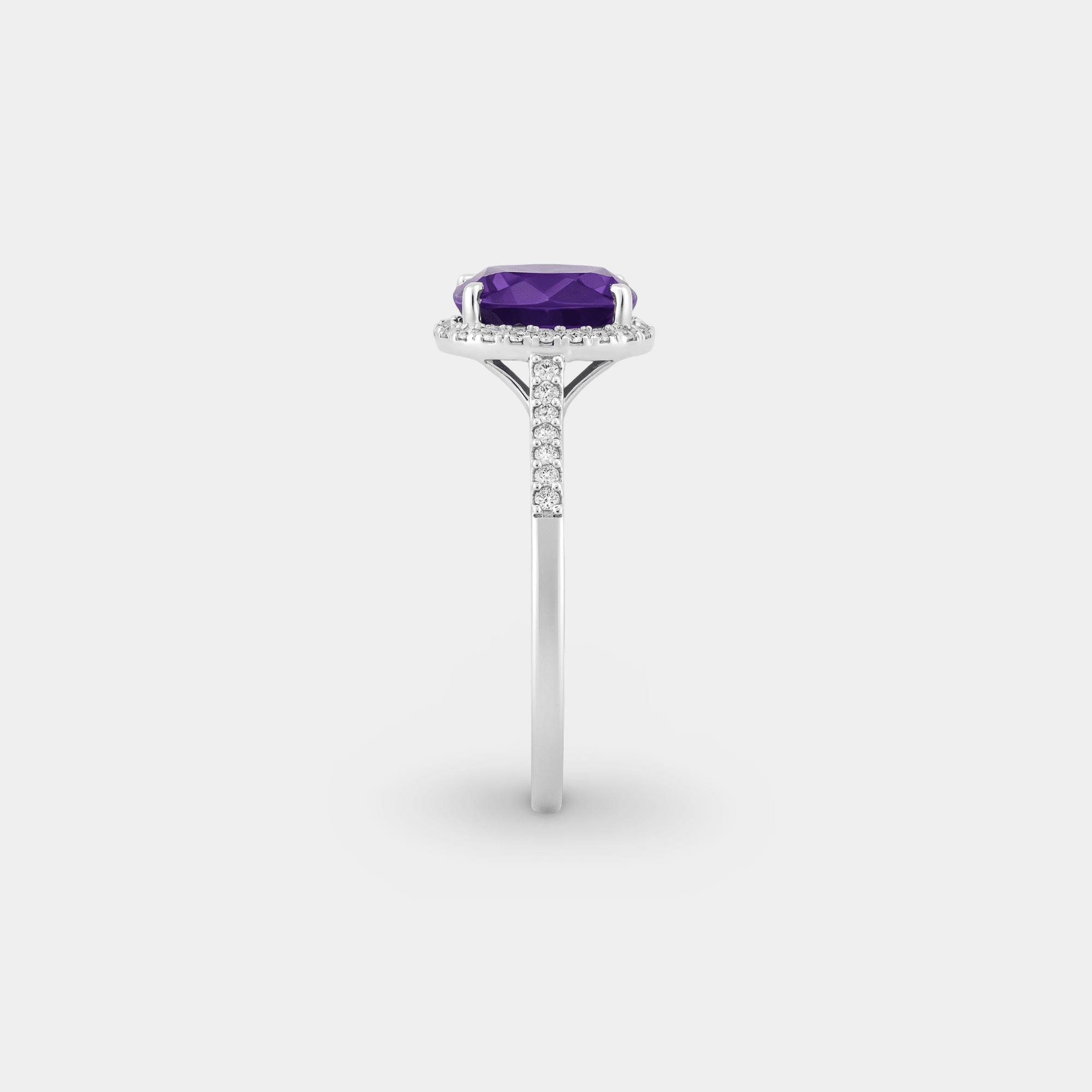 Side profile of the amethyst halo engagement ring standing upright, showing the stone height and slim pavé band